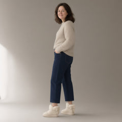 Woman wearing the bow plush ankle boots, platform sole, full length, studio