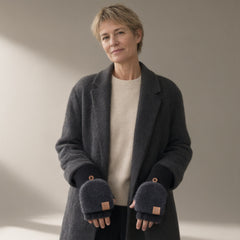 Woman wearing the flip-top fuzzy mittens, black, full length, studio