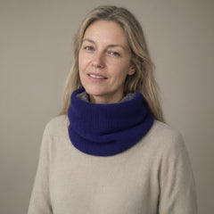 Woman wearing the knitted fleece-lined snood, pull-on neck warmer, full length, studio