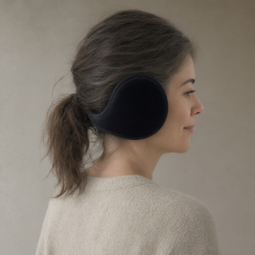 Woman wearing the behind-the-head ear warmers, plush lined, three-quarter view, studio
