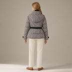 Woman seen from behind wearing the belted hooded ski jacket, padded zip-front, back view
