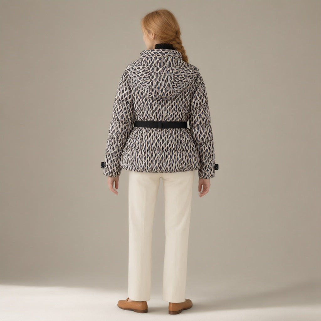 Woman seen from behind wearing the belted hooded ski jacket, padded zip-front, back view