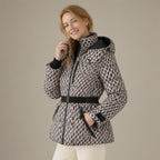 Woman wearing the belted hooded ski jacket, padded zip-front, three-quarter view, studio
