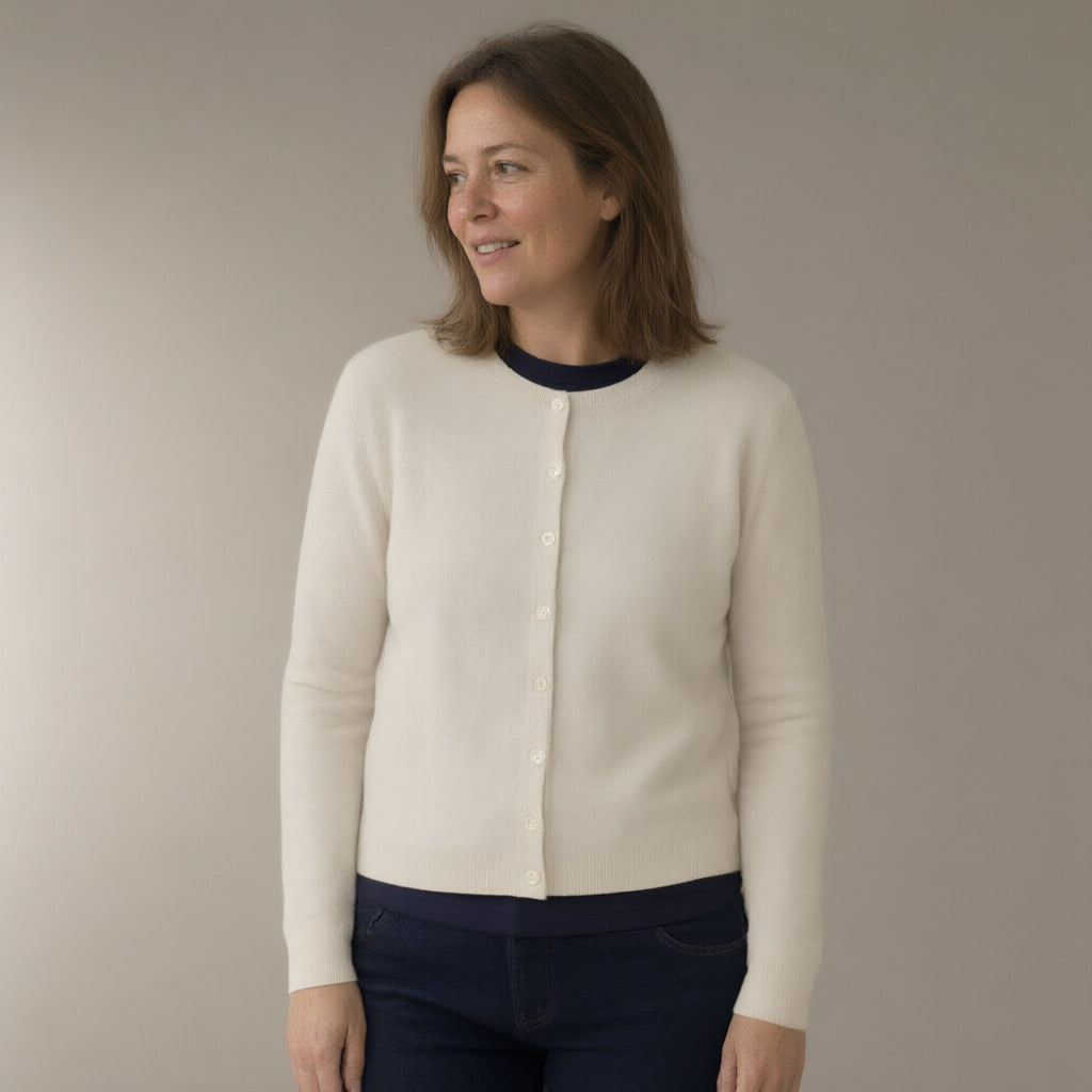 Woman wearing the button-front knit cardigan, three-quarter view, studio