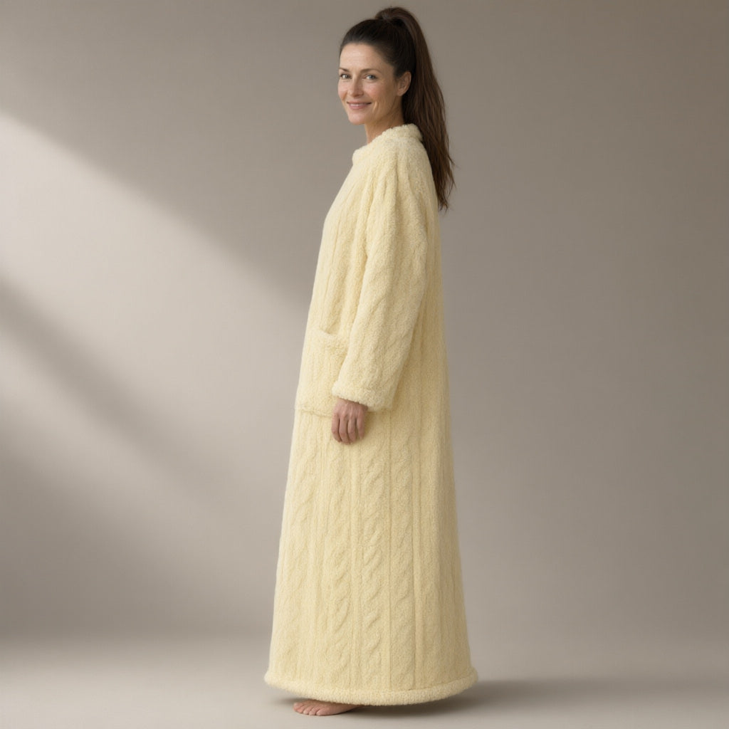 Woman wearing the cable-texture fleece nightdress, pull-on, full length, three-quarter view, studio