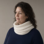 Woman wearing the chunky wool snood, pull-on neck warmer, three-quarter view, studio