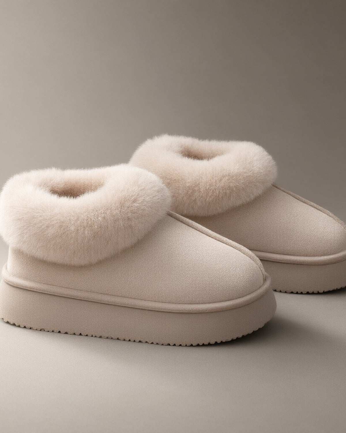 Women’s Closed-Back Fleece-Lined Slipper Boots, laid flat on a stone backdrop