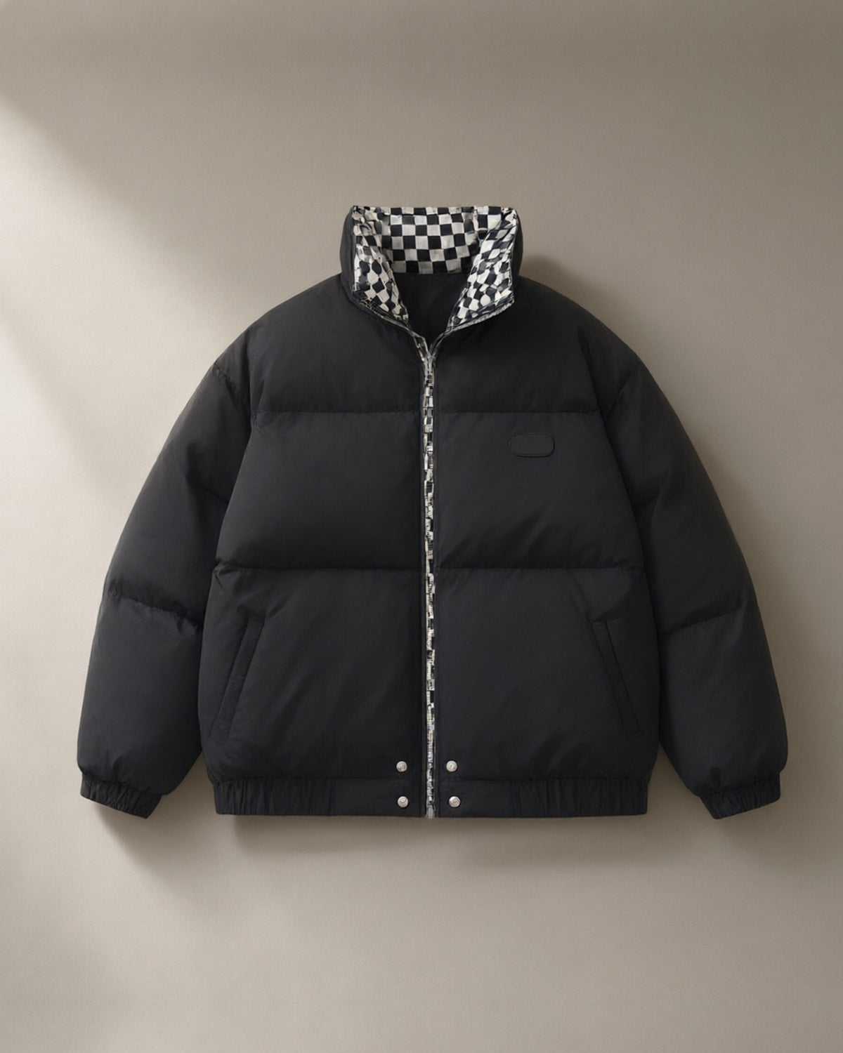 Women’s Contrast-Collar Short Puffer Jacket, laid flat on a stone backdrop