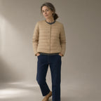 Woman wearing the convertible collar light down jacket – 90% duck down, full length, studio