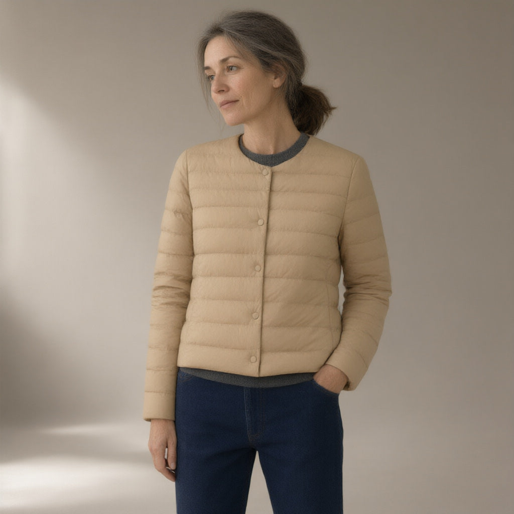 Woman wearing the convertible collar light down jacket – 90% duck down, three-quarter view, studio