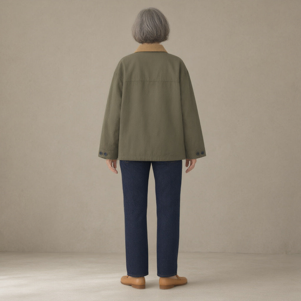 Woman seen from behind wearing the corduroy-collar barn jacket, patch pockets, back view