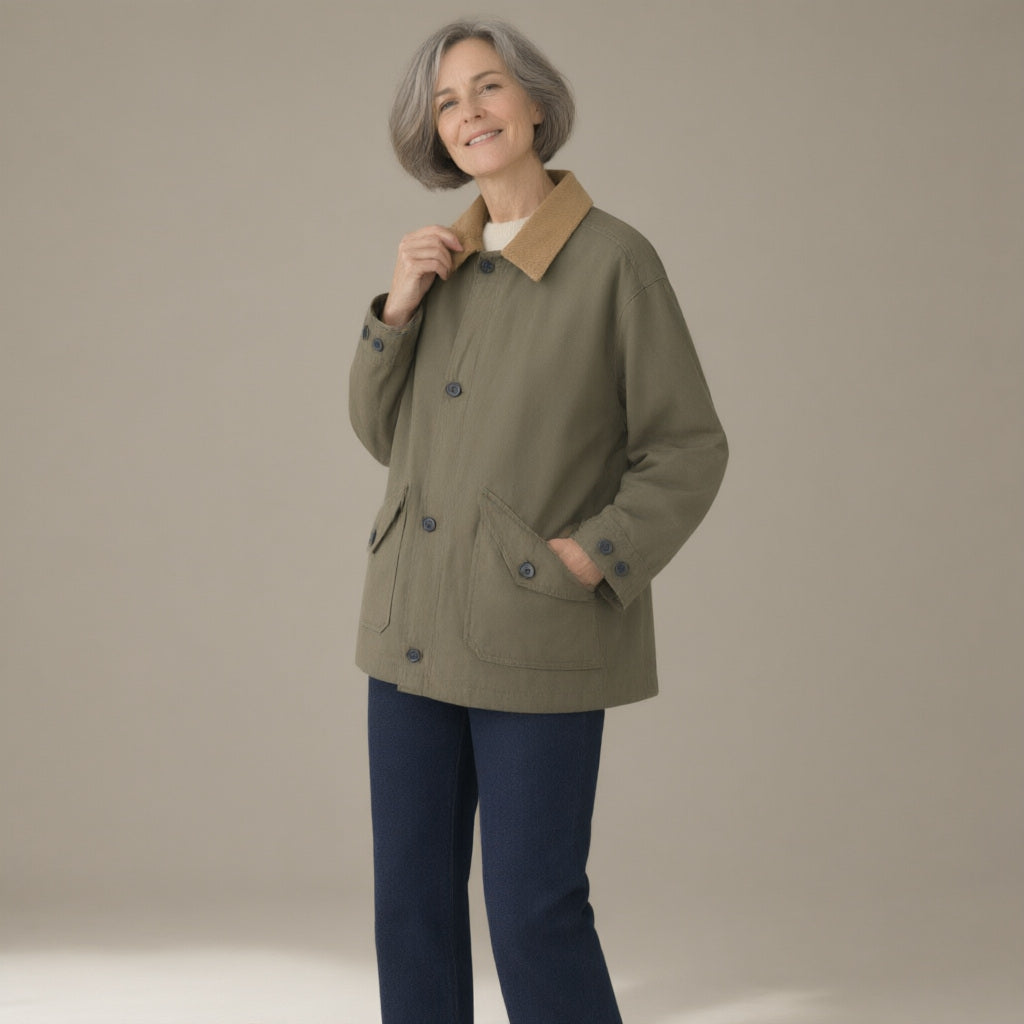 Woman wearing the corduroy-collar barn jacket, patch pockets, three-quarter view, studio