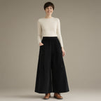 Woman wearing the wide-leg corduroy culottes, elastic waist, full length, studio