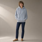 Woman wearing the fleece hoodie, cross-front pocket, full length, studio