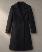 Women’s Long Double-Breasted Coat, Tailored Collar – Black, laid flat on a stone backdrop