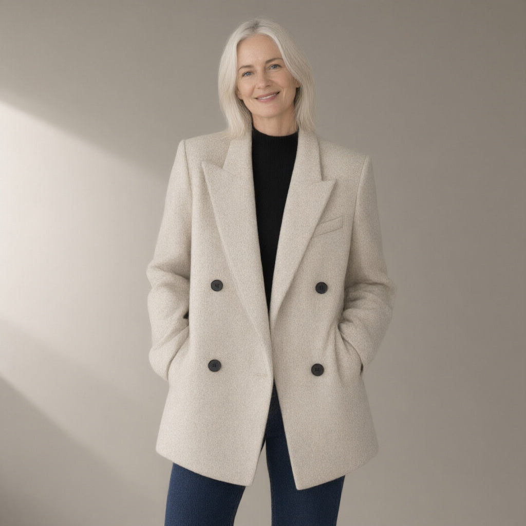 Woman wearing the double-breasted wool coat, 70% wool, three-quarter view, studio