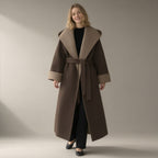 Woman wearing the double-faced wool wrap coat, hooded tie-belt, full length, studio