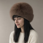 Woman wearing the faux fur cossack hat, three-quarter view, studio