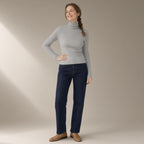 Woman wearing the fitted turtleneck base layer, ribbed knit, full length, studio