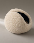 Women’s Windproof Fleece Earmuffs, Folding Band, laid flat on a stone backdrop