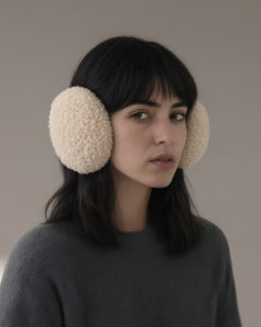 Woman wearing the windproof fleece earmuffs, folding band, full length, studio