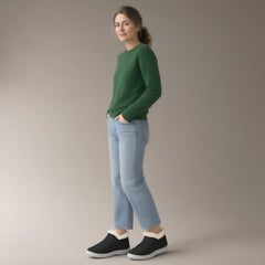 Woman wearing the fleece-lined slip-on ankle boots, full length, studio