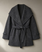 Women’s Belted Wrap Coat, Oversized Fold Collar, laid flat on a stone backdrop