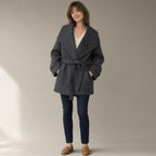 Woman wearing the belted wrap coat, oversized fold collar, full length, studio