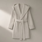 Women’s Hooded Belted Wool Coat, Double-Faced – Off-White, laid flat on a stone backdrop