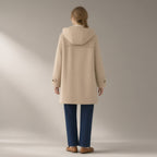 Woman seen from behind wearing the horn-button hooded duffle coat, wool-look, back view