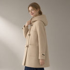 Woman wearing the horn-button hooded duffle coat, wool-look, three-quarter view, studio
