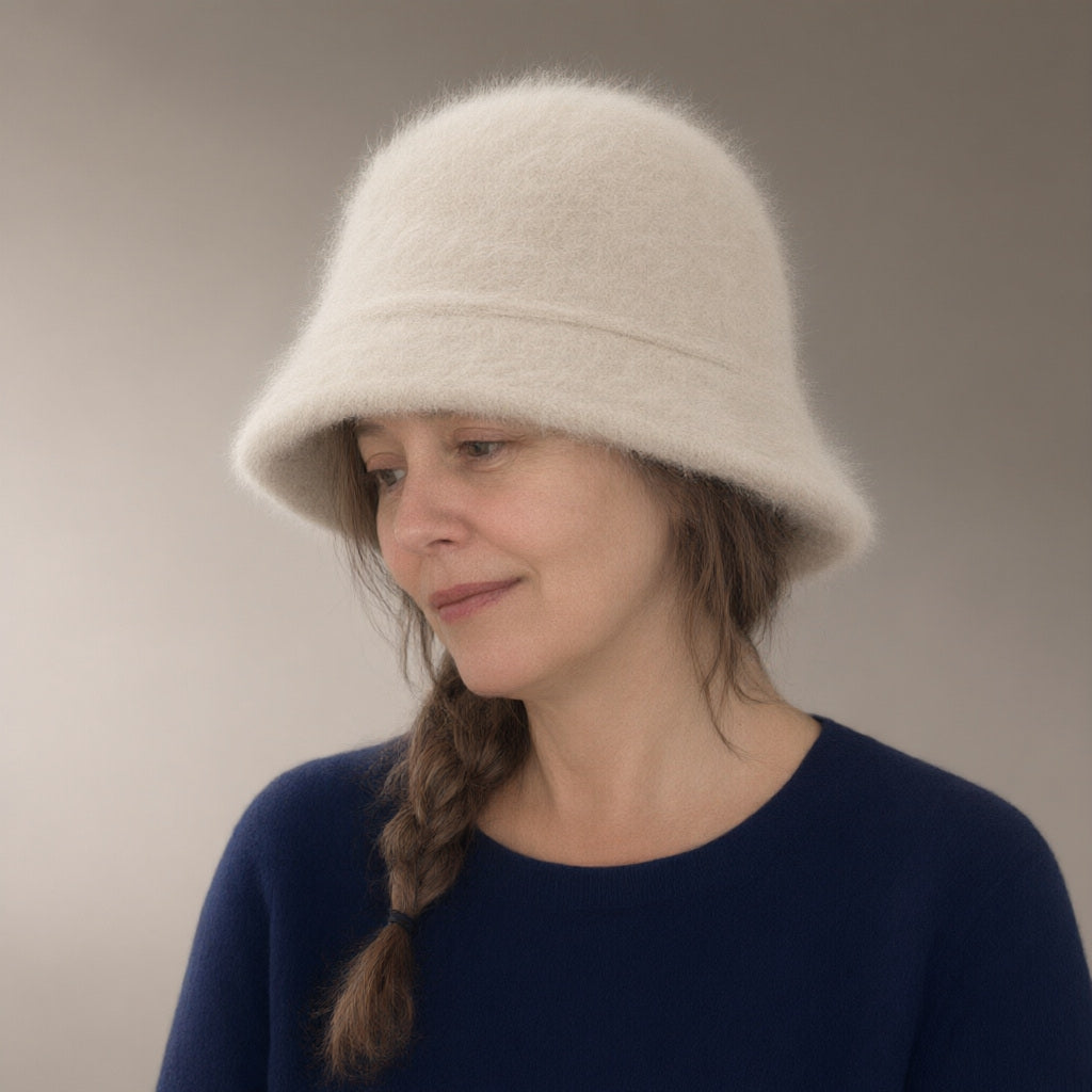 Woman wearing the knit fluffy bucket hat, three-quarter view, studio