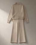 Women’s Knit Jumper & Wide-Leg Trouser Set – Oatmeal, laid flat on a stone backdrop