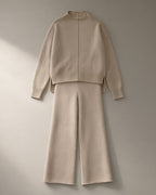 Women’s Knit Jumper & Wide-Leg Trouser Set – Oatmeal, laid flat on a stone backdrop