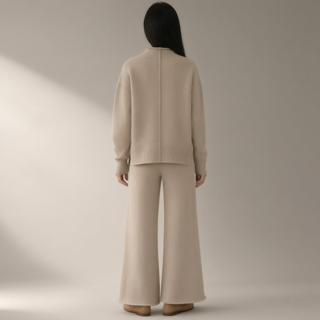 Woman seen from behind wearing the knit jumper & wide-leg trouser set – oatmeal, back view