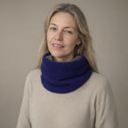 Woman wearing the knitted fleece-lined snood, pull-on neck warmer, full length, studio