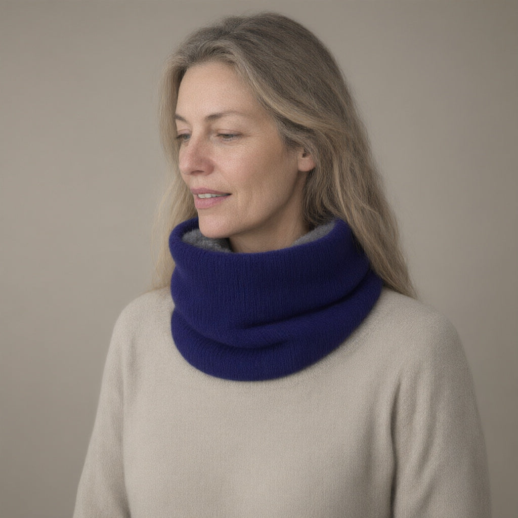 Woman wearing the knitted fleece-lined snood, pull-on neck warmer, three-quarter view, studio