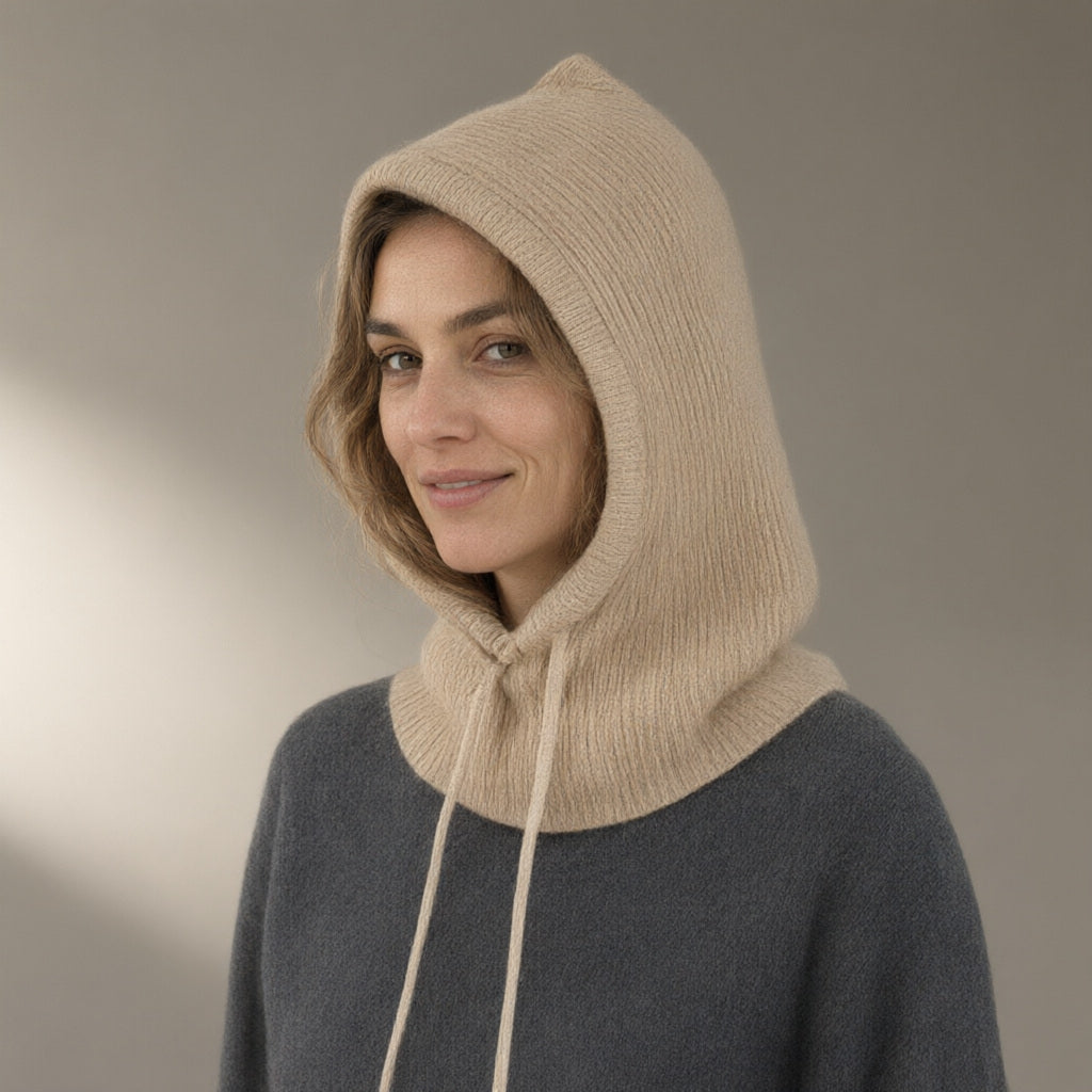 Woman wearing the knitted hood, drawstring neck, full length, studio