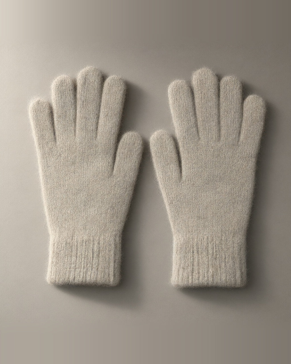 Women’s Knitted Stretch Gloves, Wrist-Length, laid flat on a stone backdrop