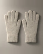 Women’s Knitted Stretch Gloves, Wrist-Length, laid flat on a stone backdrop