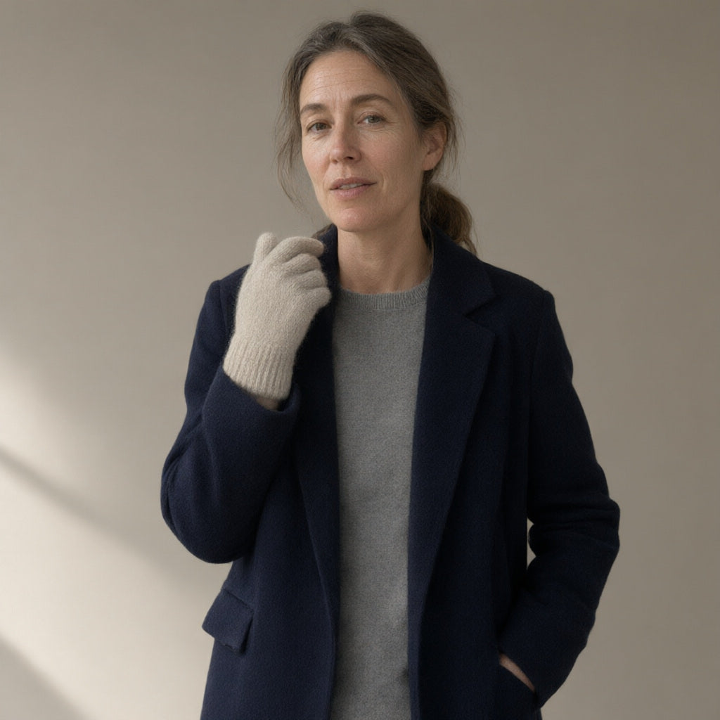 Woman wearing the knitted stretch gloves, wrist-length, full length, studio