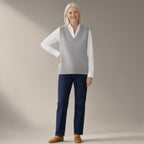 Woman wearing the knitted v-neck sweater vest, full length, studio