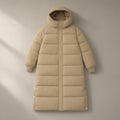 Women’s Long Hooded Puffer Coat, Over the Knee, laid flat on a stone backdrop