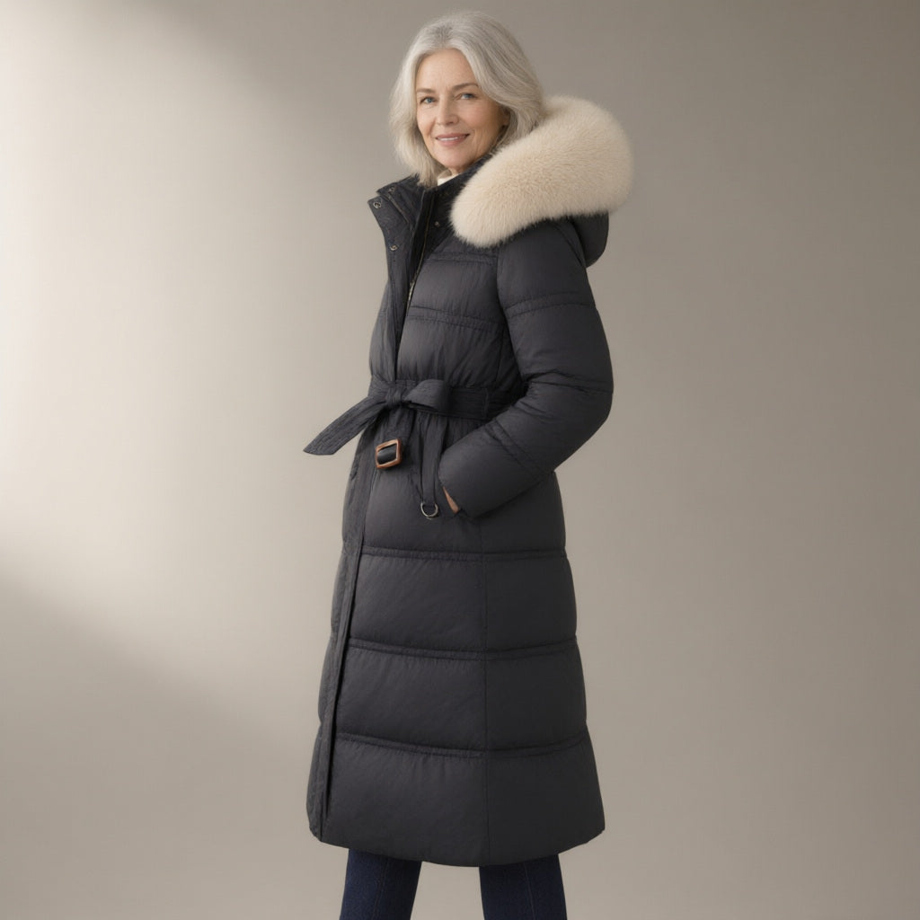 Woman wearing the long puffer coat, detachable faux fur collar, three-quarter view, studio