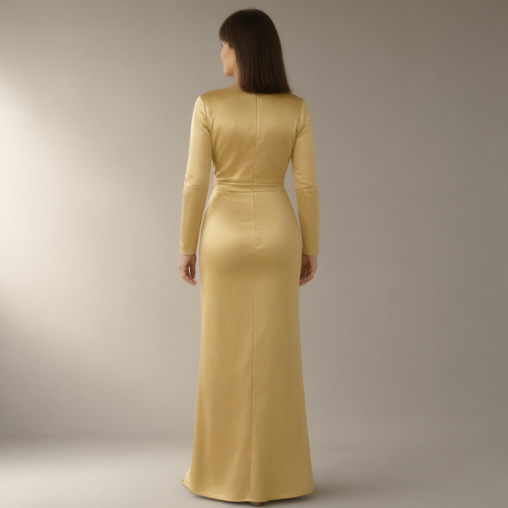 Woman seen from behind wearing the long-sleeve satin prom dress, wrap slit – gold, back view
