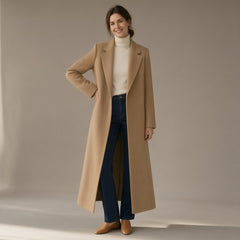 Woman wearing the long wool-look coat, back slit, full length, studio