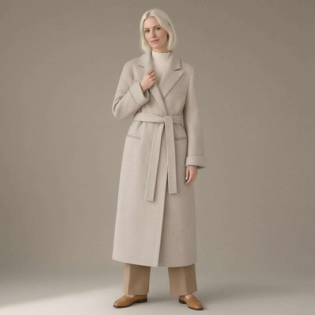 Woman wearing the longline tie-waist wool coat, double-faced, full length, studio