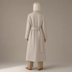 Woman seen from behind wearing the longline tie-waist wool coat, double-faced, back view