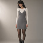 Woman wearing the merino-blend knit camisole dress, three-quarter view, studio