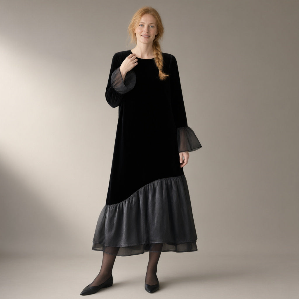 Woman wearing the mesh hem velvet midi dress, flared sleeve – black, full length, studio